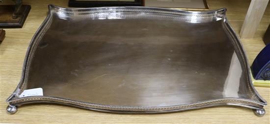 A plated serpentine-shaped tray